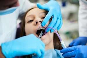 A girl getting braces.