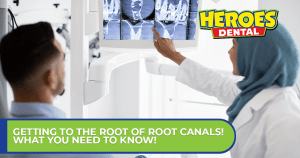 A dentist pointing to an x-ray of a tooth's root.